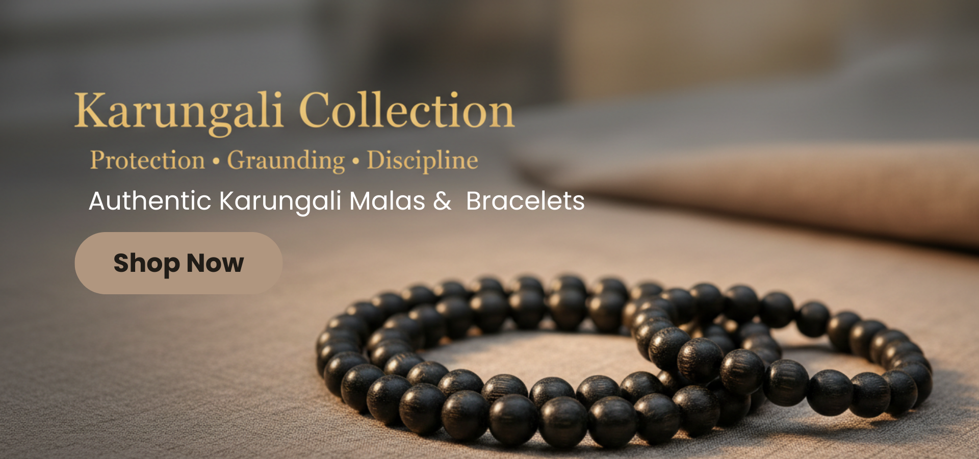 Black beaded bracelet on a wooden surface with 'Karungali Collection' text.